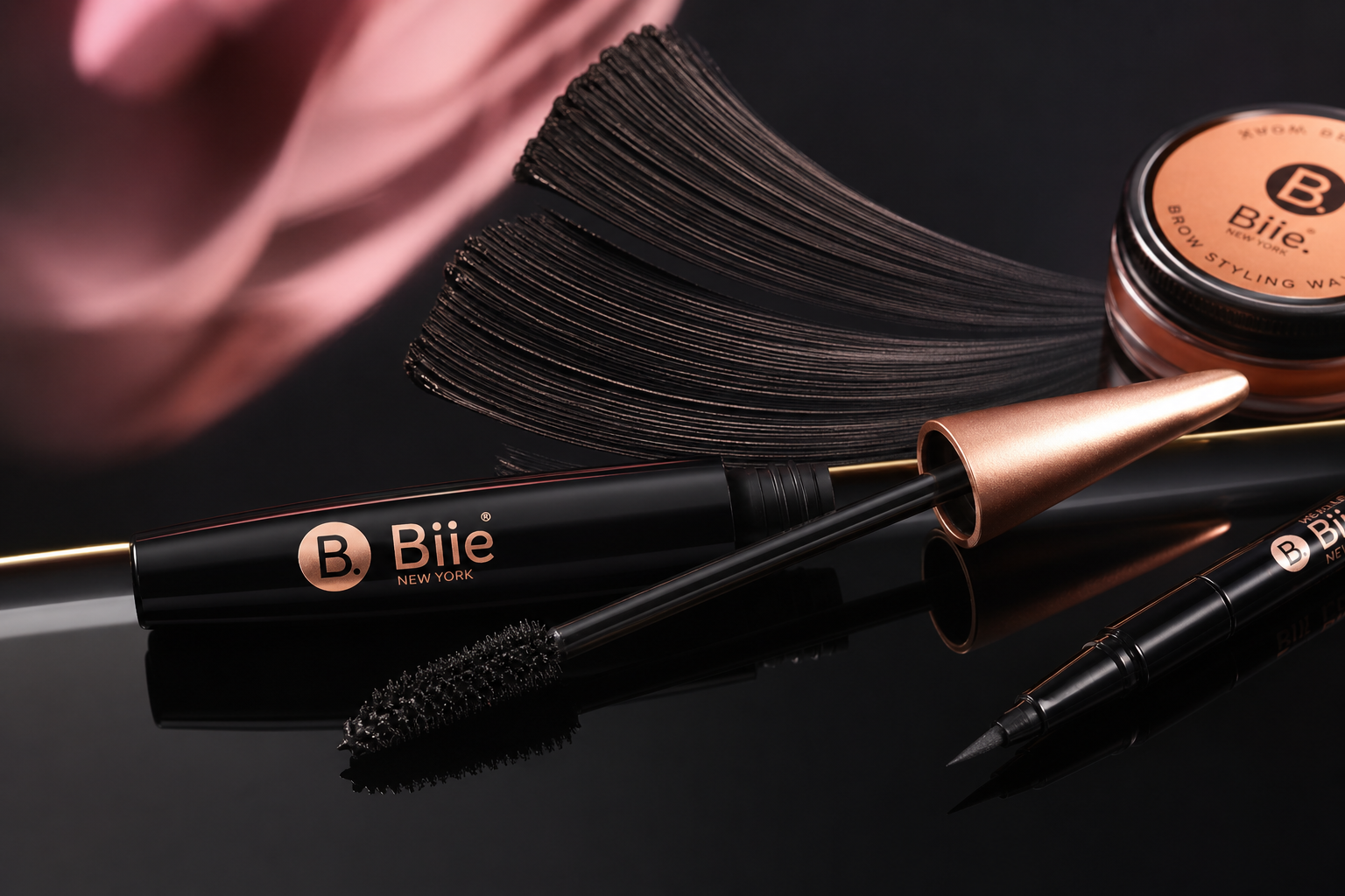 BIEE mascara and eyeliner on glossy black surface